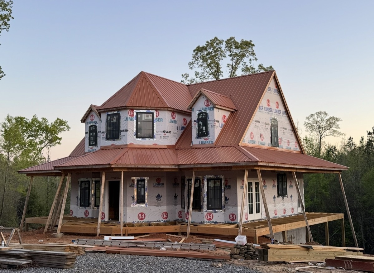 After: new standing seam metal roof installed by Craftsman Roofing LLC on a Northport home