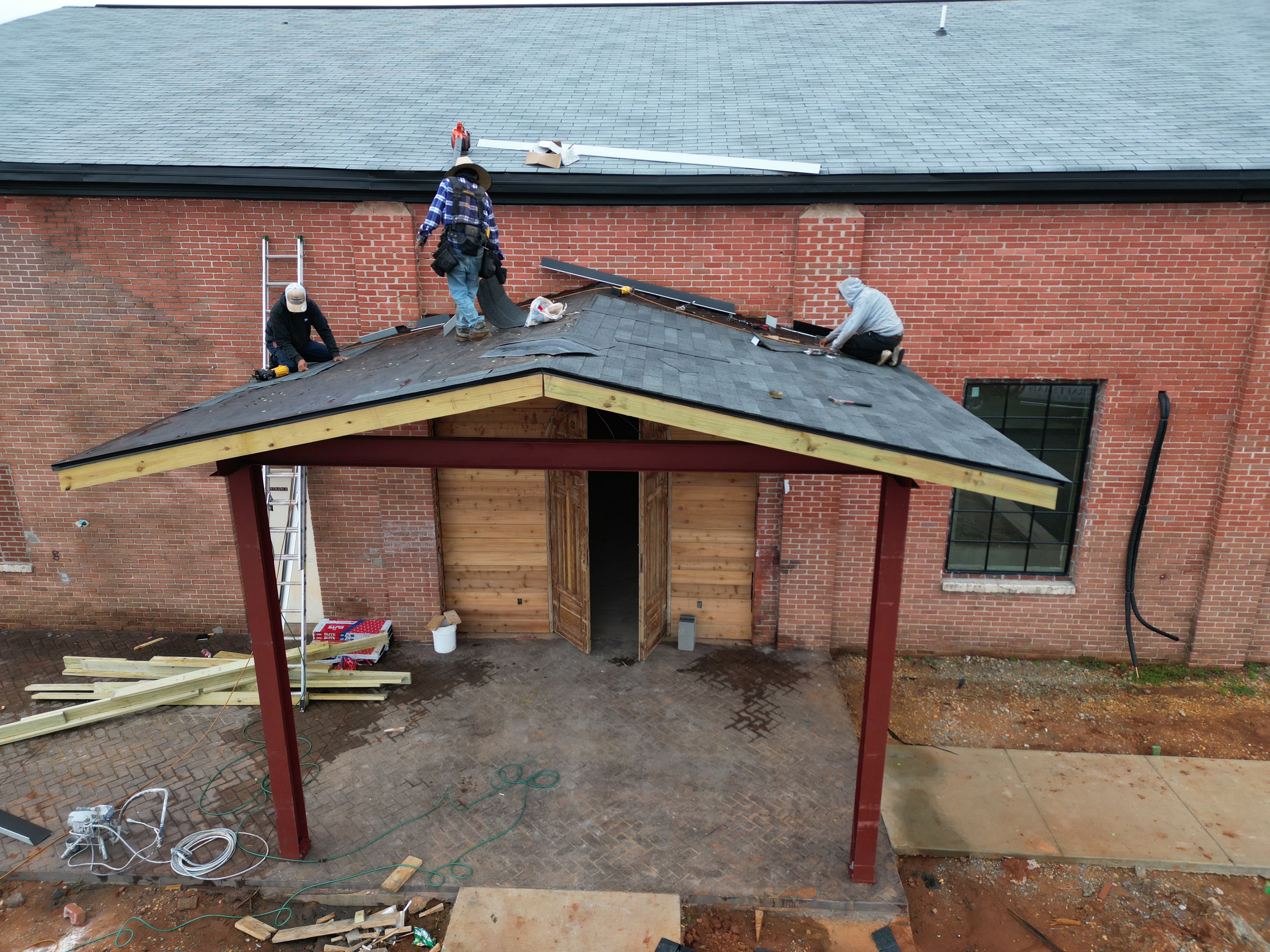 Craftsman Roofing crew working on a commercial roofing project