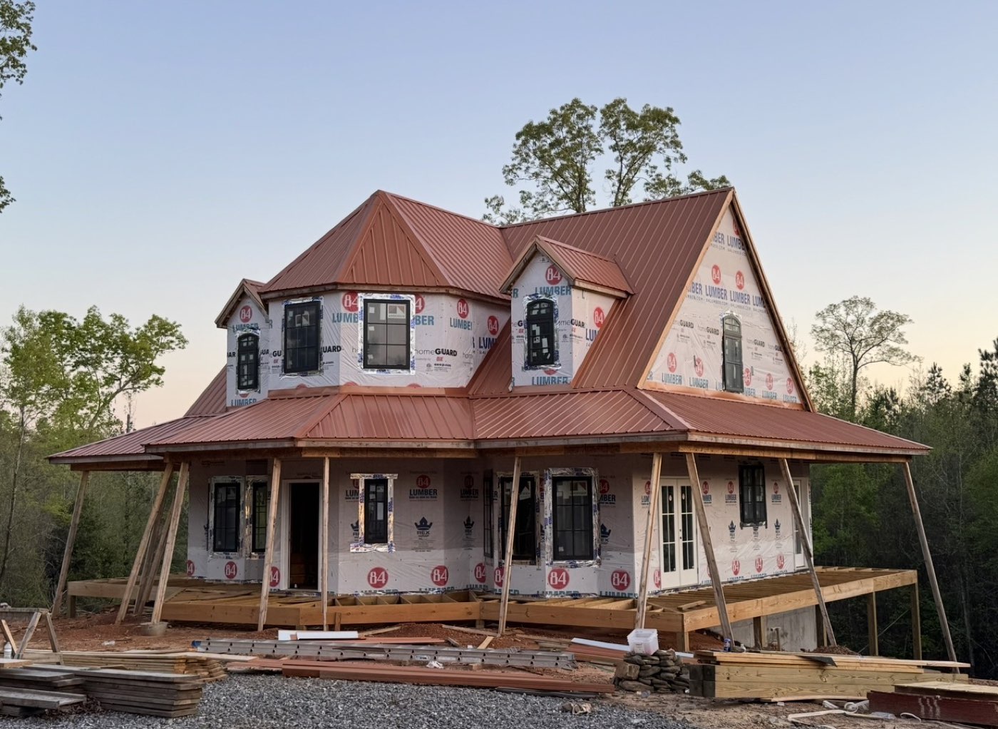 Standing-seam metal roof installation on an Alabama home