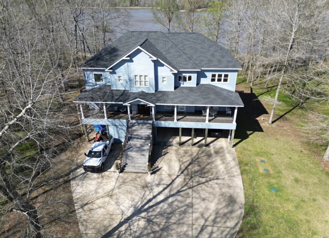 Finished residential roof with GAF Charcoal shingles installed by Craftsman Roofing